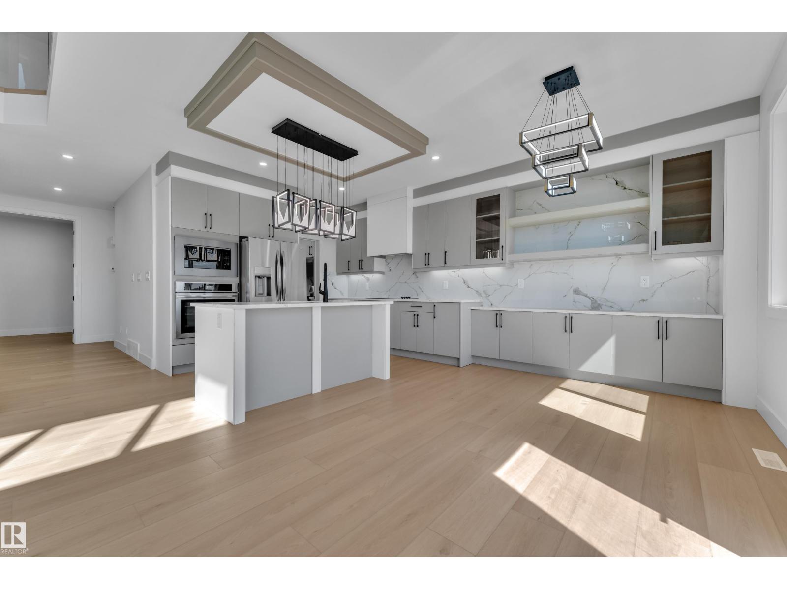 Kitchen with linear pendant lighting