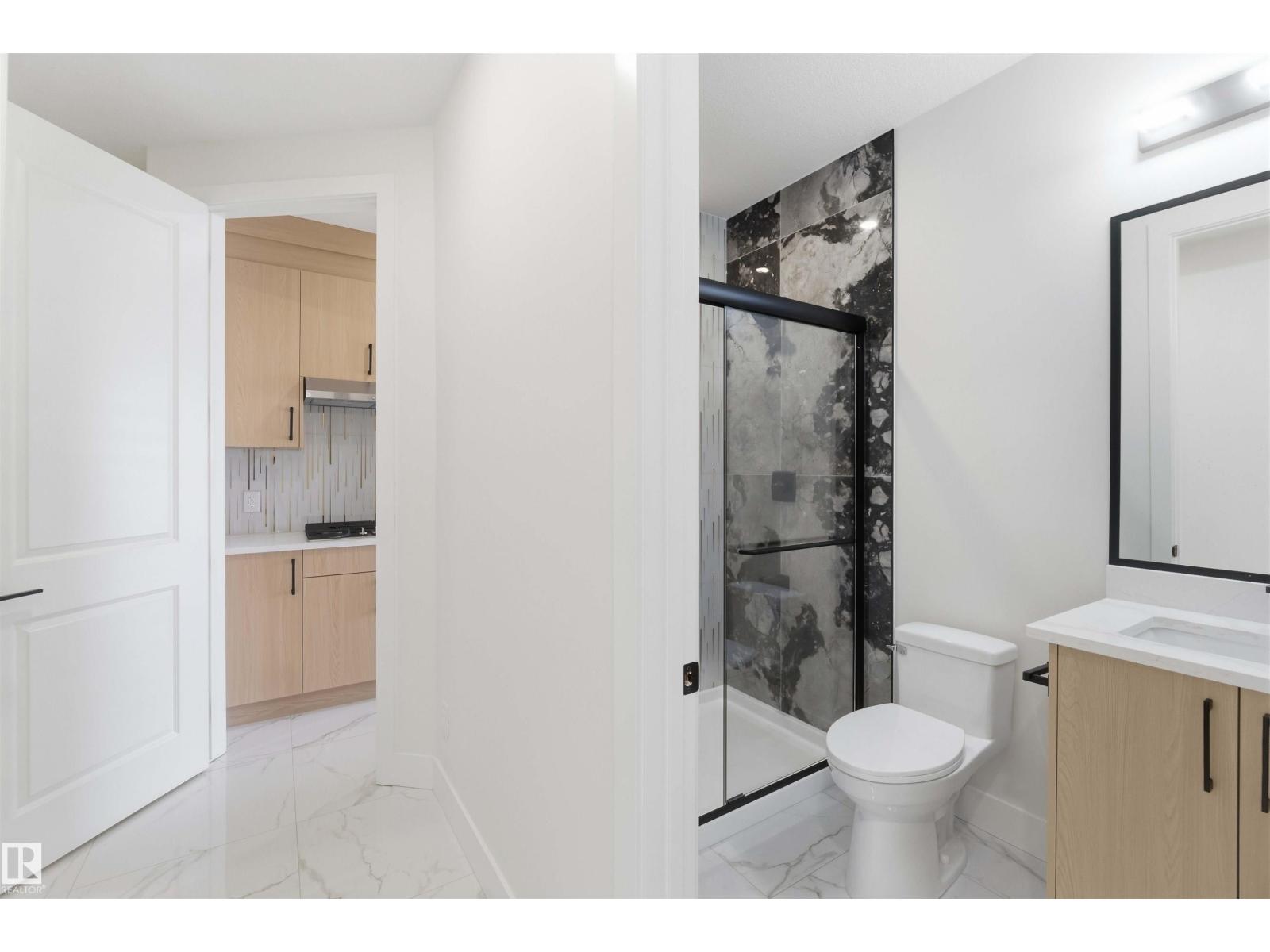 Main bathroom with dark marble shower