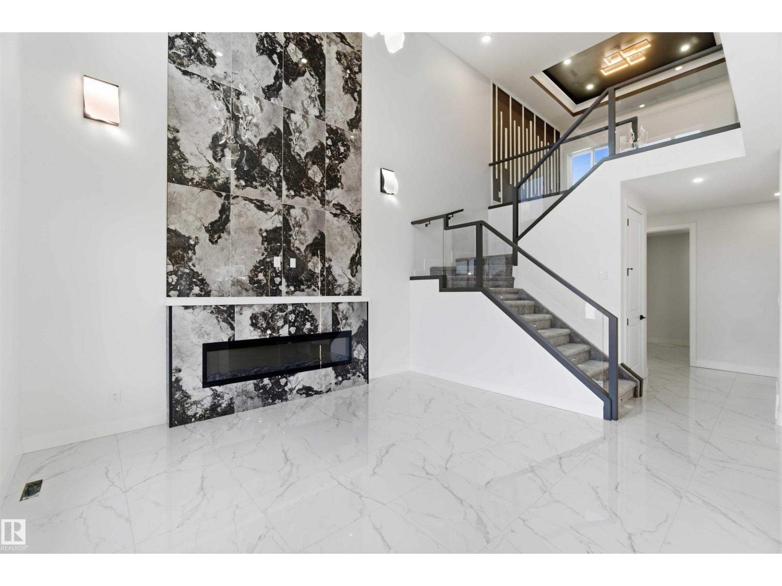 Fireplace feature wall and staircase, wide view